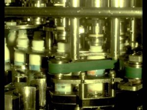 Bottle capping production line filmed in slow motion with Fastec high speed camera